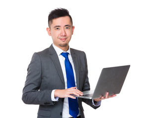 Businessman use of the notebook computer