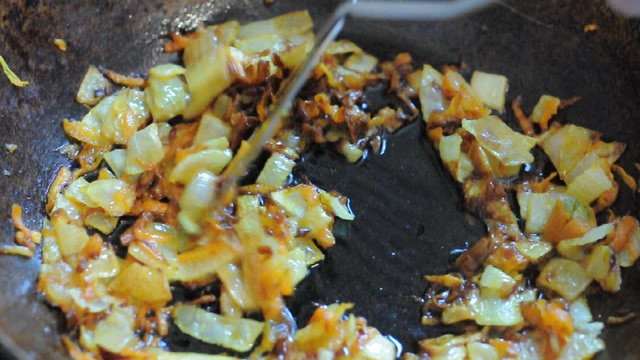 Vegetables being fried in a wok