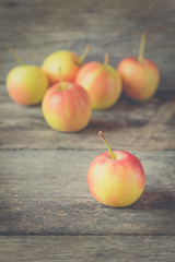 Apples on old wooden background -  vintage effect style