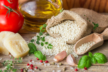 Raw rice and ingredients for cooking risotto