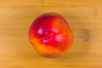 Nectarine on wooden background