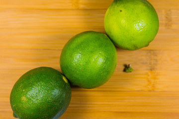Close up tropic fruits lime on the wood table