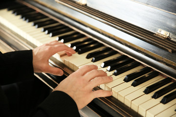 Obraz premium Close up of man hands classic piano playing