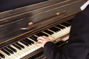 Close up of man hands classic piano playing