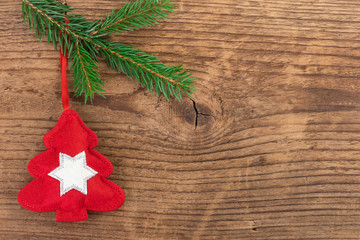 Christmas tree decoration with fir branch over wood