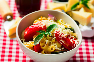 spaghetti with vegetables ,tomatoes and basil