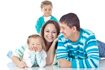 Happy family with kids in studio, white background