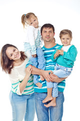 Happy family with kids in studio, white background