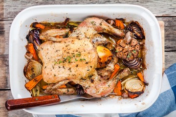 whole baked chicken with vegetables and thyme