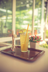 Citrus lemonade in pitcher and glasses on table vintage color