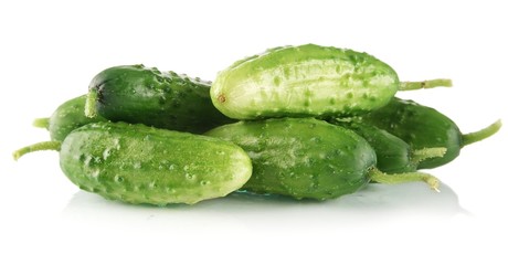 Many fresh raw cucumbers isolated on white