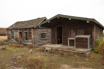 Old abandoned log cabin house