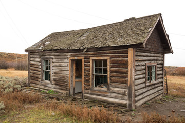 Old abandoned log cabin house
