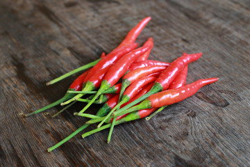 fresh red chilli on old wood background