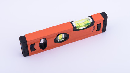 level tool in orange on white background