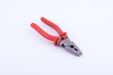 pliers with red plastic on white background