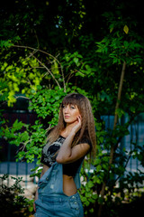 beautiful girl in denim overalls