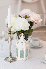 table with vase and  white candlestick  