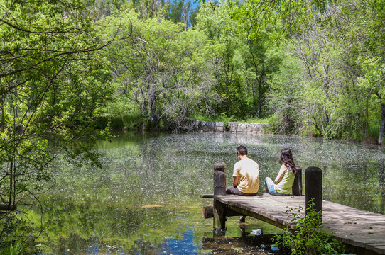 Couple enjoying the spring in a fantasy lake