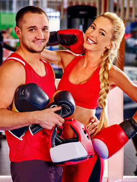 Female boxer with your male coach after workout.