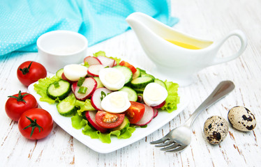 Spring salad with eggs, cucumbers and radish