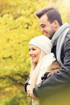 Young romantic couple in the park in autumn