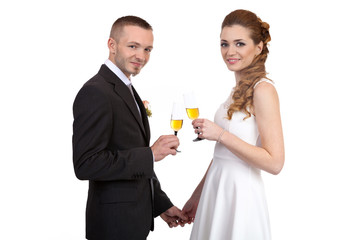 Young wedding couple with champagne glasses
