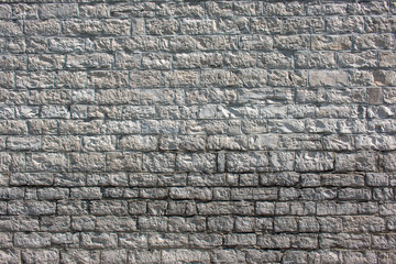 Hintergrund –Natursteinmauermit eckigen Steinen