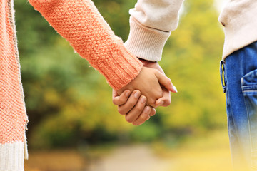 Couple holding hands in the park © Kalim