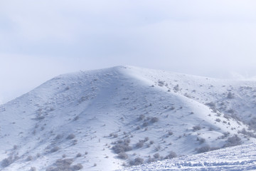 Fototapeta na wymiar snowy mountains of Tien Shan mountains in winter