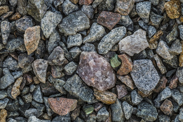 Сlean crushed stone gravel.
Natural granite gravel used for construction. Clean the surface of stones washed by rain.