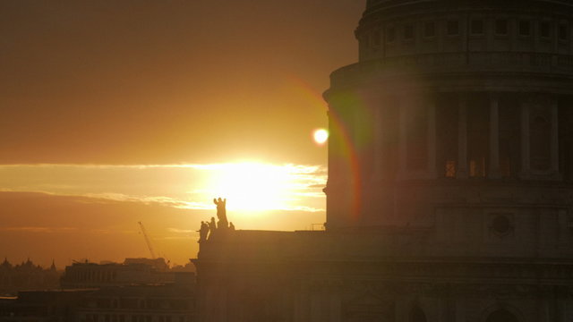 A cinematic, telephoto sunset view by St Paul's Cathedral in the City of London, England, UK
