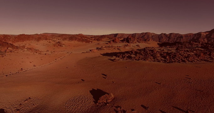 AERIAL flying forward above dramatic surface of planet Mars (artistic rendering)