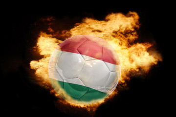 Fototapeta premium football ball with the flag of hungary on fire