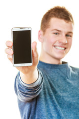 Young man showing black blank phone screen