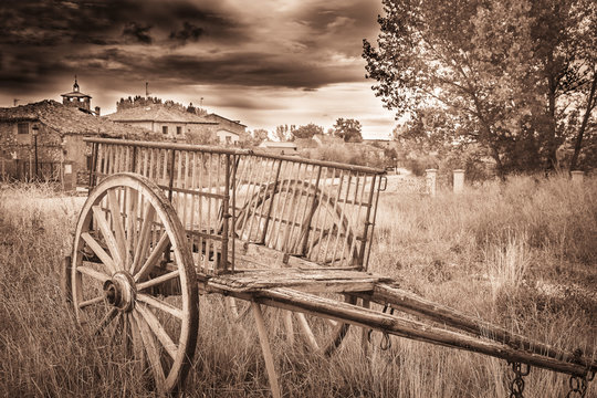 monochrome of an old chariot on an ancient village