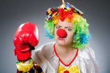 Funny clown with boxing gloves