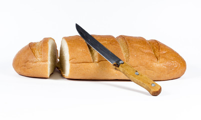 bread and kitchen knife on white background