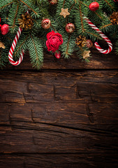 Christmas fir tree with decoration on a wooden board