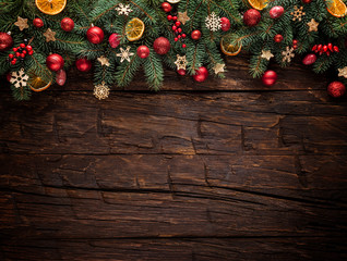 Christmas fir tree with decoration on a wooden board