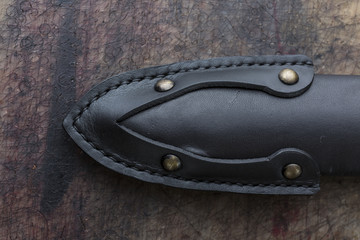 Close up photo of a black leather belt made by leather goods craftsman