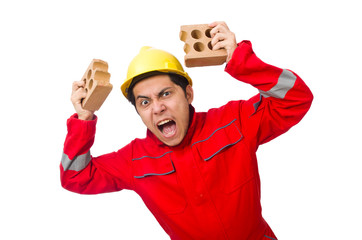 Construction worker with clay bricks on white