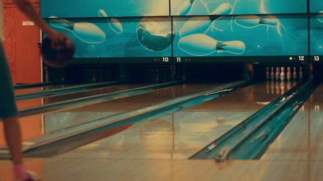 Girl playing bowling