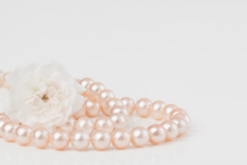 Pastel pink pearls with rose