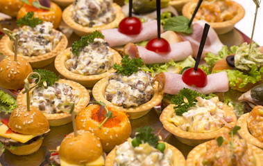 pink salmon salad and vegetables on a table in a restaurant