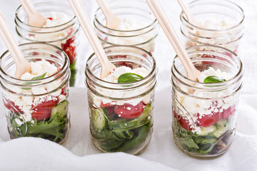 Fototapeta na wymiar Salad in mason jars