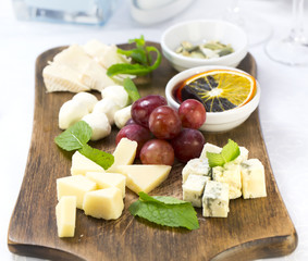 cheese plate with a large decorated the assortment of mint