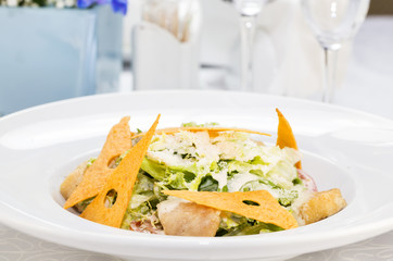 Caesar salad on the table in a restaurant