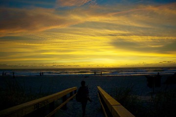 Yellow sky before sunrise at the beach