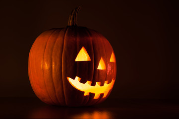 Fototapeta premium Halloween pumpkin glowing in the dark